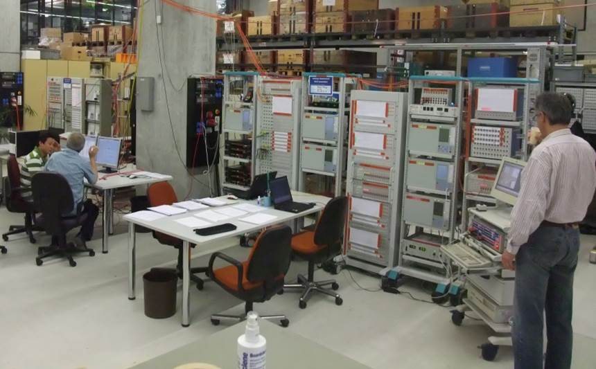Factory hardware-in-the-loop testing of a control and protection system